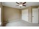 Bedroom featuring neutral walls, carpet, a closet and access to a door to another room at 4784 Raven Run, Broomfield, CO 80023