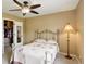 Bedroom with a ceiling fan, closet, and neutral color palette at 4784 Raven Run, Broomfield, CO 80023