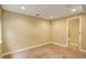 Finished bedroom with neutral colors, a new door and carpet at 4784 Raven Run, Broomfield, CO 80023