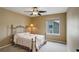 Bedroom with a ceiling fan and neutral color palette at 4784 Raven Run, Broomfield, CO 80023