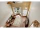 Bright entryway features hardwood floors, a ceiling fan, and a view of the front door and bay window at 4784 Raven Run, Broomfield, CO 80023