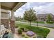 Landscaped front yard view, featuring a well-maintained lawn, colorful flowers, and a charming residential street at 4784 Raven Run, Broomfield, CO 80023