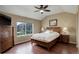 Main bedroom with a ceiling fan, natural light, and hardwood floors at 4784 Raven Run, Broomfield, CO 80023