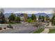 Scenic neighborhood view with lush greenery and mountain views, showcasing the community's natural beauty at 4784 Raven Run, Broomfield, CO 80023