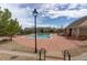 Community pool area offers a refreshing escape with seating, surrounded by lush landscaping at 4784 Raven Run, Broomfield, CO 80023