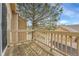 Private balcony with wood flooring and railing overlooking a tranquil neighborhood setting at 9585 Brentwood Way # D, Westminster, CO 80021