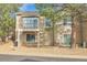 Exterior home view featuring a private balcony, large windows, and low-maintenance landscaping at 9585 Brentwood Way # D, Westminster, CO 80021