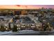 Breathtaking aerial view of the condos with scenic landscape and beautiful sunset, showing a desirable location at 5677 S Park Pl # C208, Englewood, CO 80111