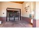 Secured entrance to Village Lofts features brick accents and gated access for added safety and peace of mind at 5677 S Park Pl # C208, Englewood, CO 80111