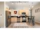 Modern kitchen with stainless steel appliances, sleek countertops, and a breakfast bar with seating at 5677 S Park Pl # C208, Englewood, CO 80111
