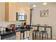 This kitchen features stainless steel appliances and an island, perfect for entertaining guests at 5677 S Park Pl # C208, Englewood, CO 80111