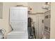 A laundry area features a stacked washer and dryer, providing space-saving convenience at 5677 S Park Pl # C208, Englewood, CO 80111