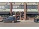 Charming exterior of a building with unique architectural details and inviting storefronts at 2245 Blake St # C, Denver, CO 80205