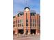 Impressive exterior of a building with distinctive architecture, clock tower, and prominent signage at 2245 Blake St # C, Denver, CO 80205