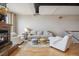 Living room featuring hardwood floors, fireplace, comfortable seating, and neutral colors at 2245 Blake St # C, Denver, CO 80205