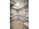 This walk-in closet offers functional storage with its adjustable shelving and convenient layout at 2245 Blake St # C, Denver, CO 80205