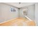 Well-lit bedroom with hardwood floors and sunny windows at 5610 E Amherst Ave, Denver, CO 80222