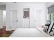 Bright bedroom featuring beautiful hardwood floors, white trim and built in storage at 3001 S Josephine St, Denver, CO 80210
