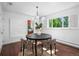 Elegant dining room featuring modern lighting, hardwood floors, and stylish dining table with chairs at 3001 S Josephine St, Denver, CO 80210
