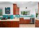 Bright kitchen with custom cabinets, granite countertops, tiled backsplash, and stainless steel appliances at 3001 S Josephine St, Denver, CO 80210