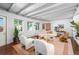 Bright living room with beam ceiling, modern furniture, and hardwood floors, with lots of natural light at 3001 S Josephine St, Denver, CO 80210