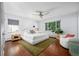Spacious main bedroom with a ceiling fan, hardwood floors and plenty of natural light at 3001 S Josephine St, Denver, CO 80210