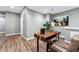 Basement with wood flooring, a desk, and artwork at 6771 Canosa St, Denver, CO 80221