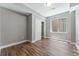 Bright bedroom with wood flooring, a closet, and a window at 6771 Canosa St, Denver, CO 80221