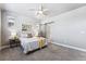 Spacious bedroom with sliding barn door to en-suite bath at 6771 Canosa St, Denver, CO 80221