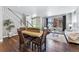 Bright dining area with hardwood floors and a view into the living room at 6771 Canosa St, Denver, CO 80221