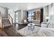 Inviting living room features hardwood floors, natural light, and comfortable seating at 6771 Canosa St, Denver, CO 80221