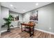 Home office with wood desk, chair, and artwork at 6771 Canosa St, Denver, CO 80221