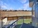 Back deck features artificial turf, stone pavers, metal railings, and great neighborhood views at 5470 Danube St, Denver, CO 80249