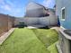 Backyard has a well-maintained artificial lawn, and is fully fenced for privacy at 5470 Danube St, Denver, CO 80249