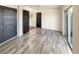 Spacious bedroom features wood-look floors, ample closet space, and a sliding glass door to the outside at 5470 Danube St, Denver, CO 80249