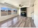 Bright living room showcasing a fireplace and large windows at 5470 Danube St, Denver, CO 80249