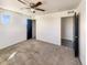 A relaxing main bedroom with a ceiling fan, neutral colors, and access to closet at 5470 Danube St, Denver, CO 80249