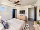 A relaxing main bedroom with a ceiling fan, dresser, and neutral colors at 5470 Danube St, Denver, CO 80249