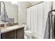 Bathroom with a sink, vanity, toilet, shower, and decorative towels at 60 Stewart Way, Erie, CO 80516