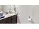 Bathroom with dark cabinets, white countertop, and stylish fixtures at 60 Stewart Way, Erie, CO 80516