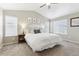 Bedroom with a large bed, neutral tones, plush carpet, and ample natural light at 60 Stewart Way, Erie, CO 80516