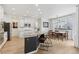 Kitchen with granite countertops, an island with seating, and stainless steel appliances, with dining area visible at 60 Stewart Way, Erie, CO 80516
