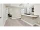 Kitchenette with breakfast bar, undermount sink, and stainless dishwasher at 60 Stewart Way, Erie, CO 80516