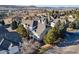 Aerial view of townhouses with well maintained landscaping and green spaces in community at 2796 Newport Cir, Castle Rock, CO 80104