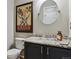 Powder room featuring a stylish mirror, granite countertop, and modern fixtures at 2796 Newport Cir, Castle Rock, CO 80104