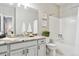 Well-lit bathroom with granite countertops, complemented by neutral tones, a combined shower, and a relaxing atmosphere at 2796 Newport Cir, Castle Rock, CO 80104