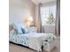 Charming bedroom with a twin bed, complemented by a serene color palette and natural light streaming through a large window at 2796 Newport Cir, Castle Rock, CO 80104