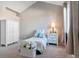 Bright bedroom with a twin bed, complemented by a serene color palette and natural light streaming through a large window at 2796 Newport Cir, Castle Rock, CO 80104