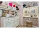 Custom closet featuring shelving, storage and a lighted vanity area at 2796 Newport Cir, Castle Rock, CO 80104