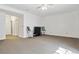 Spacious living room with neutral carpet, ceiling fan, and a modern entertainment setup, ideal for relaxation and entertainment at 2796 Newport Cir, Castle Rock, CO 80104